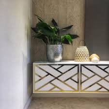 While We Re Talking Chippendale Let S See How Luxe These Mirrored Gold Styl Panels Look On A Floating Ikea Tv Con Ikea Tv Console Ikea Hack Furniture Makeover