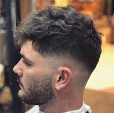 Low skin fade with long wavy hair. 16 Best Low Skin Fade Haircuts For 2021