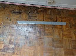 You can purchase wood filler at a hardware store or online. Parquet Hardwood Floor Water Damage Repair Or Rip It Out