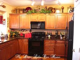 Currently mine has vintage still life oil paintings. Christmas Decorating Ideas Above Kitchen Cabinets Decoratorist 43623