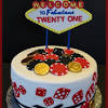 Decorate a large round cake as a poker chip. 3