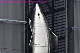 In the distance, the first super heavy booster prototype (bn1) continues stacking operations. Spacex Rolls Starship To The Launch Pad Five Days After Last Flight Test