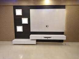 In addition, you can see various examples of modern tv wall units, designed. Tv Unit With Wallpaper In Background Vr Interior Designerss Asian Style Living Room Plywood White Homify