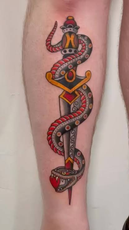 Traditional tattoo of a Snake and dagger on the shin #snaketattoo ...