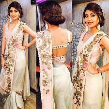 It has a sleeveless choli cut pattern with the shoulder strap caressing the shoulders softly and gently with an arch which makes it all the more beautiful. 50 Latest Saree Blouse Designs For 2019 That Will Amaze You Latest Saree Blouse Saree Look Shilpa Shetty Saree
