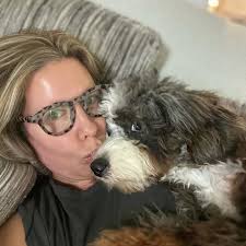 Cute bernedoodle puppy loves playing fetch