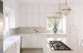 Under cabinet lighting beautifully highlights the color and texture of the stone. Dove Gray Subway Tiles With White Shaker Cabinets Transitional Kitchen