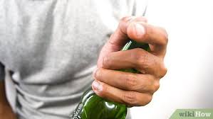 Then position the tip of the knife under the lip, so that it's between the cap and the glass. 4 Ways To Open A Beer Bottle Wikihow