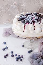 This was wonderful and so easy to make! Homemade Meringue Cake Pavlova With Whipped Cream Sugar Powder Fresh Blueberries And Blueberry Sauce On Vintage Cake Stand On Beige Concrete Texture Background Gauze Textile Stock Photo Picture And Royalty Free Image