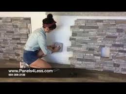 With detailed shading and stones of various sizes, this peel and stick backsplash has the realistic look of slate. How To Install Fake Stone Wall Panels Diy Youtube