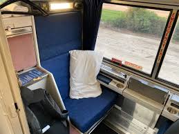 It s furnished with two large sofas and two easy chairs next to large windows. Amtrak Viewliner Sleeper Car Roomette Review