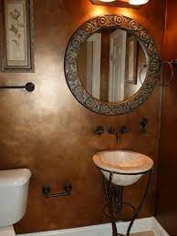 While it's a bit on the darker side, it has has warm elements, which makes it quite versatile. Bronze Painted Walls Bronze Looking Walls Painted Treat Your Guests To A Beautiful Oasis Small Bathroom Decor Gray Bathroom Decor Faux Painting Walls