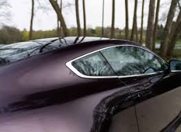 Image result for Amethyst Red 2012 Aston Martin