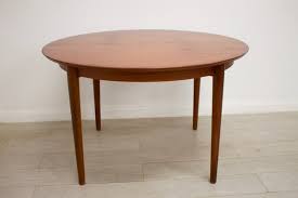 49 wide x 49 deep x 29.5 inches high; Mid Century Teak Veneer Round Dining Table 1960s For Sale At Pamono
