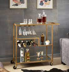 High and low shelves sit as chords spanning the circular frame. Chelsea Lane Champagne Gold Mirror Glass Metal Bar Cart Walmart Com Walmart Com