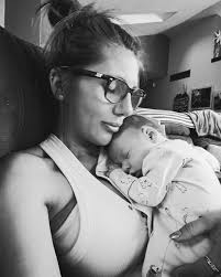 The only yellow and green were fans of! 🚜 💜💛 Hadleys first visit to the  farm! @bennytrainer1 @lori.morrison.520 #givemesomemorrisonofthat  #johndeerebaby #farmlife