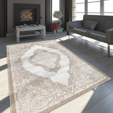 Heute sind sie so aktuell wie nie. Teppich Orient Look Ornamente Gold Creme Teppichcenter24