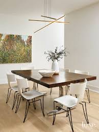 Get more information on bloomington mn dining room furniture. Modern Meets Historical In This Chicago Art Deco Building The Dining Room Is Minimal With A Wood Topped Table And Modern White Chairs Luxe Interiors Design
