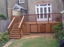 Hardwood Deck With Storage The Broom Is Not Just A Theatrical Prop We Do Actually Clean Up After Buiding O Under Deck Storage Patio Deck Designs Deck Storage