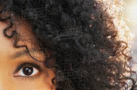 It requires more hydration, less washing, and, if we're being detangling hair from the bottom up allows you to gently detangle each knot, rather than compounding knots toward the bottom and yanking your way through. Close Up Of Eye And Curly Hair Of Mixed Race Woman Stock Photo Dissolve