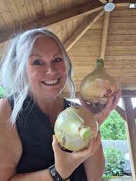 Just a 53 year old woman who's over the moon. With her mammoth onion  harvest this year