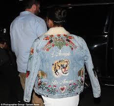 Rihanna Flashes Leg In White Dress And Statement Denim Jacket Rihanna Outfits Jackets Denim Jacket