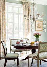 I also noted the dining settee behind the round table and just love the elegant shape which draws the eye up along the ceiling line of the room. French Settee At French Oval Dining Table Traditional Dining Room