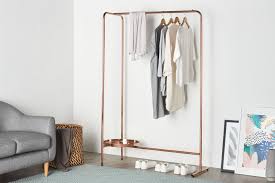 This modern coat rack design made from black walnut wood is both stylish and functional. Clothes Rack 13 Clothes Rails For Bedroom Hallway Storage
