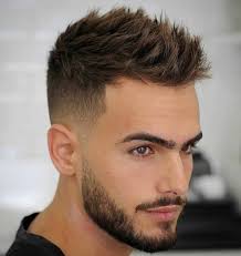 Brushed forward hairstyle with mid skin fade. Men S Haircuts New Trends In 2021