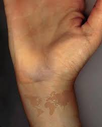 Birthmark On Leg Meaning 25 Of The Best Travel Tattoos In The Entire World World Map Tattoos Brown Tattoo Ink Map Tattoos