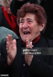 Bishop Eugene Hurley of Darwin gets his face painted with an... News Photo 
