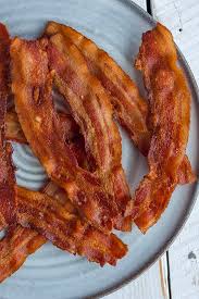 Line a baking sheet with parchment paper. How To Bake Bacon In The Oven Sustainable Cooks