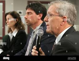 Canadian Coast Guard spokesperson Tim Surette, right, Search and Rescue  Superintendent Mike Voigt, center, and Regional communications Director  Kathy Kieley listen to a question from a reporter at a press conference in