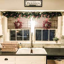 Placed high on the wall, the windows add a sense of height to this kitchen and allow additional storage at countertop height. Diy Christmas Decor Above Kitchen Sink Christmas Decor Shower Curtain Rod Wrapped In Two Christmas Kitchen Decor Diy Christmas Window Diy Christmas Garland