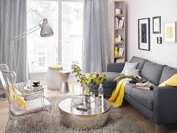 The color of the living room curtains pertains to the bookshelves and wall art to create a harmonious decor. 18 Dark Grey Sofa Dove Grey Curtains Yellow Textiles And A Vase Curtainsideasindian Small Living Room Design Yellow Living Room Grey And Yellow Living Room