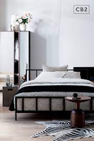 Complementing this design is a simple couch that is essential for lounging. Alchemy Matte Black Queen Bed Reviews Cb2 In 2021 Modern Bedroom Design Modern Bedroom Black Queen Bed