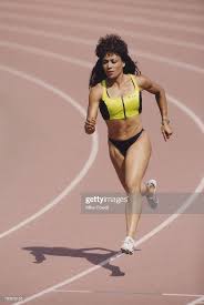 She is the fastest woman of all time; Olympic And Iaaf World Championship Gold Medal Wiinning Sprinter Female Athletes Flo Jo World Championship