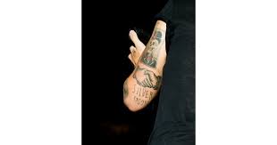 These tattoos are done voluntarily, meaning the individual has to agree to receive the tattoo. Silver Spoon Handshake Skull The Meaning Behind Harry Styles S Tattoos Well The Ones We Know About Anyway Popsugar Beauty Photo 7