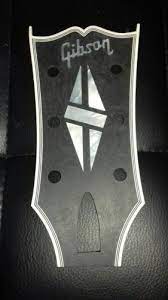 It was developed in 1953 after gibson had introduced the les paul model in 1952. Gibson Les Paul Custom Headstock Veneer Overlay Les Paul Custom Gibson Les Paul Les Paul