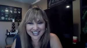 Fr. Ron Mathews with Tina Ruiz