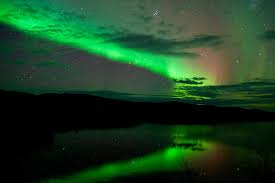 Reflections and bridge illumination can add interest to your picture. The Northern Lights Give Michigan A Show Over Mackinac Bridge