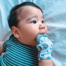 Pancho still loooves massaging his gums using his @nubyph teething mitten!  As a (super) late birthday treat, since Pancho turned one last 2/8, we are  giving away 2 teething mittens each to