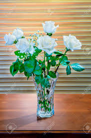 Meiliy 60pcs bulk rose leaves artificial greenery fake rose flower leaves for diy wedding bouquets centerpieces party decorations rose vine wreath garlands supplies 4.6 out of 5 stars 1,752 1 offer from $9.99 The Plant Is A Bouquet Of White Roses With Green Leaves And Small White Flowers In