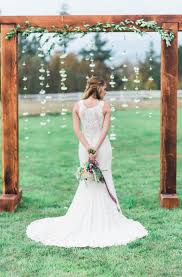 Guests sat on bails of hay for the ceremony! Rustic Boho Inspiration Rustic Wedding Chic Wooden Wedding Arches Wood Wedding Arches Simple Wedding Arch