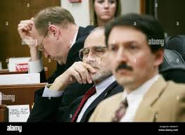 Sens. Gary Wilken, R-Fairbanks, left, Con Bunde, R-Anchorage, center, and  Gene Therriault, R-Anchorage, listen to testimony during a Senate floor  session Tuesday, May 9, 2006, at the Capitol in Juneau, Alaska. (AP