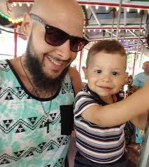 Exhausted dad sleeps under son's hospital bed after working overnight shift