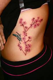 Cherry blossom tattoos are not only popular japanese tattoo style but also one of the most symbolic and meaningful tattoos. Cherry Blossom Tattoo Cherry Blossom And Butterfly Tattoo Butterfly Tattoo Butterfly Tattoos For Women Trendy Tattoos