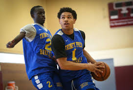 A basketball player rolling a ball from his left hand to his right hand. Daishen Nix Alaska S Hottest High School Basketball Player Will Finally Play In Alaska Anchorage Daily News