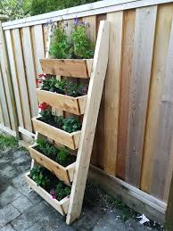 The diy planter box will have to be sturdy enough to hold plants and wet soil. To Fill The Space To The Right Of The Porch Diy Garden Projects Garden Boxes Ladder Planter