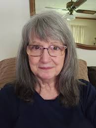 Can someone please help edit this picture. If you can remove the person in  the background and remove the 2 cups off the table and also add a nice  background. This will